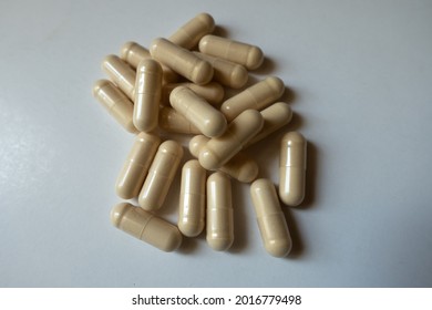 Handful Of Beige Capsules Of Milk Thistle Extract