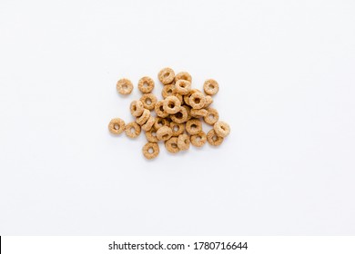 Handful Of Cereal Cheerios Or Oats In Center On White Background. 