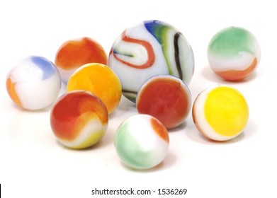 A Handful Of Colorful Milky Glass Toy Marbles Isolated On A White Background