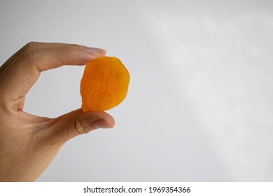 Handful Of Dried Apricots. Woman Holding Dried Apricots.