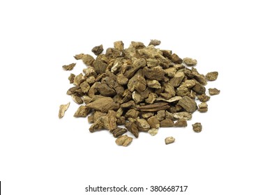 a handful of dried roots of burdock on a white background