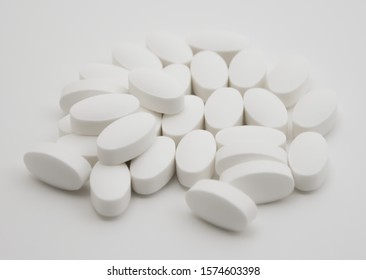 Handful of oval white pills