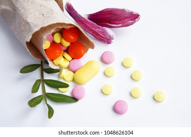 The Handful Of Tablets, Dietary Supplements, Vitamins Get Enough Sleep From The Paper Bag Made Of Textured Solid Paper