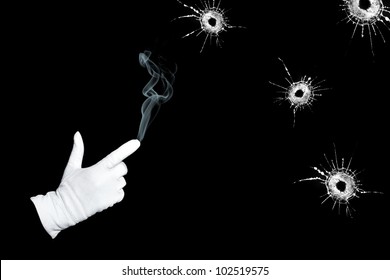 Hand-gun And Bullet Holes On A Black Background