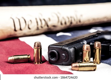 A Handgun With Bullets Symbolizing Gun Rights While Framed Against The United States Constitution.

