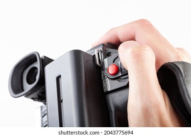 Handheld Camcorder, Old Retro Video Camera Object Held In Hand, Closeup, White Background, Cut Out. Finger On The Red Rec Record Button. Filmmaking, Movie Making Abstract Concept, First Person Pov