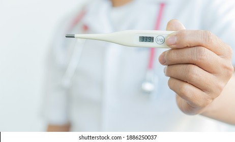 Handheld Digital Thermometer, Body Thermometer And Self Health Check And Medical Concept