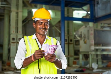 Handheld Shot Of Smiling Industrial Worker With Hardhat Couting Money - Concept Of Earnings, Banking Or Financial Support And Blue Collar Job