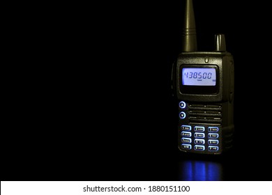 Handheld Two Way Radio On A Black Background