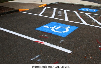 Handicap Parking Space In Standard Parking Lot.