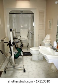 Handicapped Bathroom With Shower Chair, Lift, And Specially Designed Sink For A Wheelchair