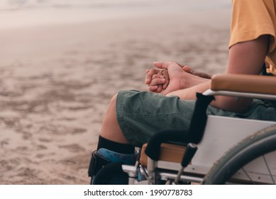 Handicapped children in wheelchairs hold their parents' hands, Positive strengthening by family from parents to disabled person, Happy disability child concept.