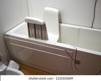 Handicapped disabled access bathroom bathtub with electric handles for people with disabilities