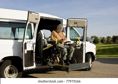 Handicapped Man Operating A Wheelchair Lift Van