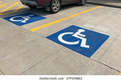 Handicapped Parking Sign On A Parking Lot / With Copy Space