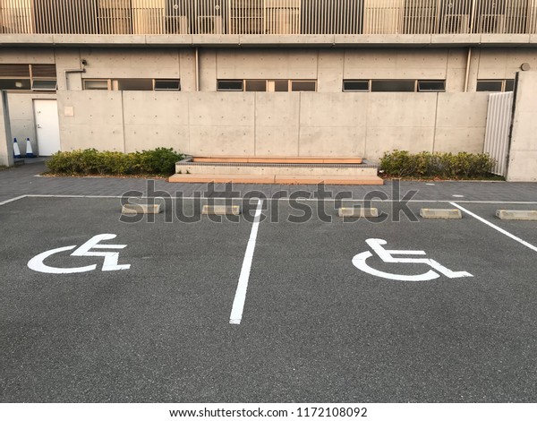 Handicapped Parking Spaces at Office Building.\
symbol car park. Handicapped parking spot - transportation\
infrastructure road\
markings