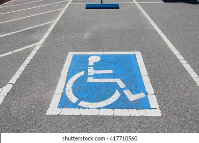 Handicapped parking spot - transportation infrastructure road markings.