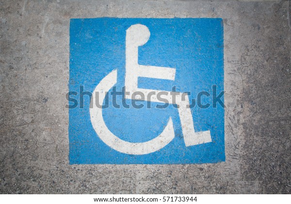 Handicapped parking spot - transportation\
infrastructure road\
markings.
