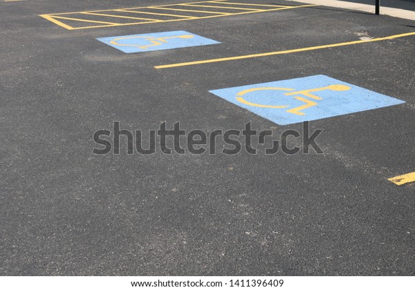 Handicapped parking\
spots in outdoor parking lot\
