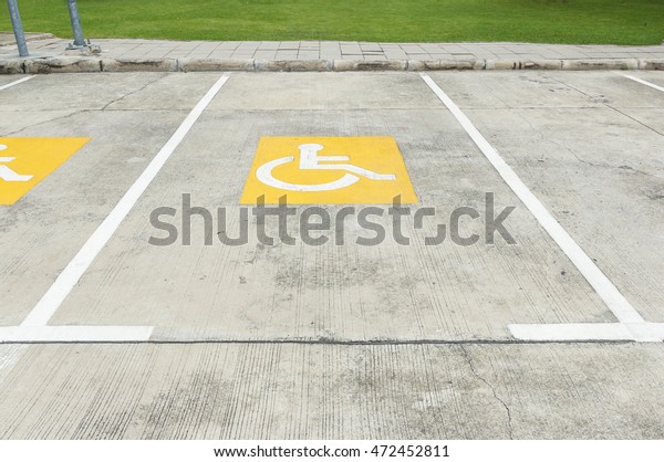 handicapped parking symbol on\
floor\
