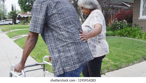 Handicapped Senior Black Man Walking Outdoors