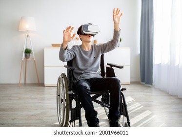 Handicapped teenager in wheelchair wearing VR headset, exploring augmented reality at home. Surprised paraplegic teenager playing virtual online game. Entertainments and modern technologies - Powered by Shutterstock