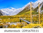 Handing foot bridge in Hooker walking track popular tourist valley to Mt Cook in New Zealand.