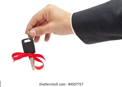 Handing Over Car Key With Red Bow As A Present