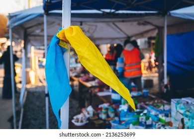A handkerchief in the colors of the national flag of Ukraine as a symbol of victory is tied to the shelter. Ukrainian refugees head to Slovak border. Uzhhorod, Ukraine - 16 March 2022.
