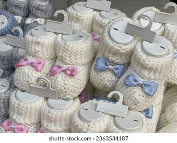 Hand-knitted baby booties wool different alternative colors Macro detail shot natural abstract pastel background images child baby fashion buying now.  - Powered by Shutterstock