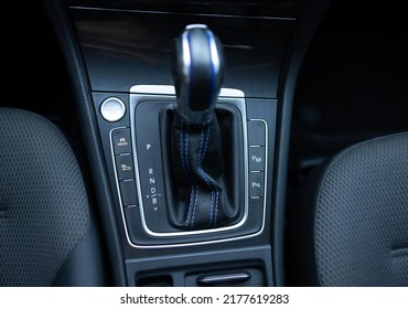 Handle of electric car gearbox control. Design details of minimalist concept of electric car - close-up details of automatic transmission and gear stick. Automatic gear lever and gear shift.