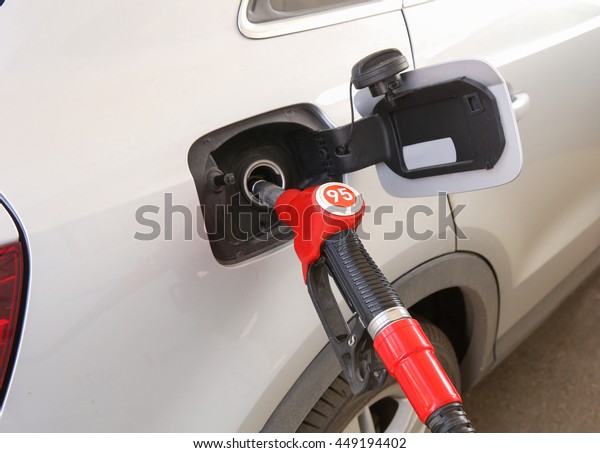 handle of the
filling gun in car gasoline
tank