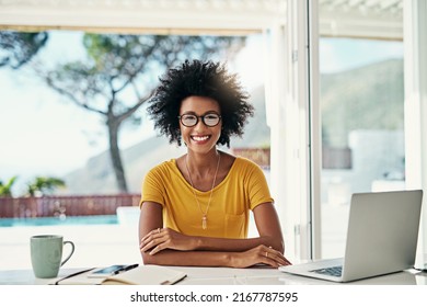 I Handle My Business. Cropped Portrait Of An Attractive Young Woman Working On Her Laptop At Home.