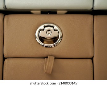 The Handle On The Back Of The Seat For Reclining.