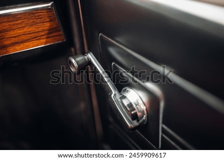 Handles for manually opening windows in a classic car