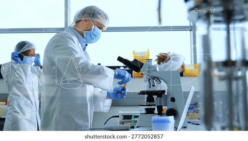 Handling scientist preparing samples at lab bench, wearing white lab coat, using microscope. Research, bioscience, analytical, collaboration, benchtop, glassware, windows