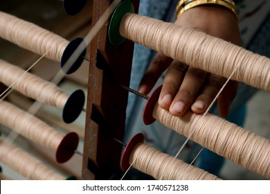 A Handloom Weaver Preparing Yarns  In India.