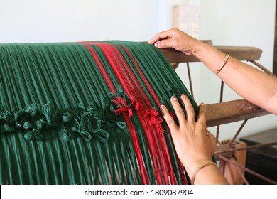 A Handloom Weaver Preparing Yarns In India.