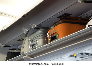 hand-luggage compartment with hand-luggage in an airplane
