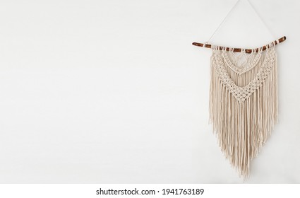 Handmade 100 Cotton Macrame Wall Decor Hanging On A White Wall. Copy Space