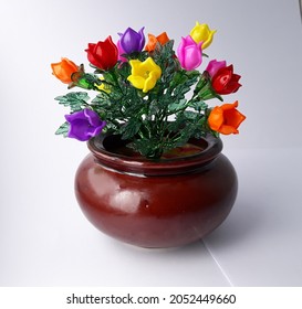 Handmade acrylic flowers craft , beauty colorful in clay pot isloated on white
