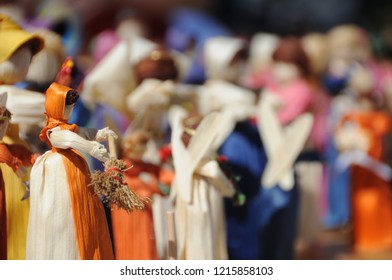 Handmade Appalachian Corn Husk Dolls/ People With Many Bright Colors. Closeup Shows Corn Husk Texture, Natural Dyes, And Quality Craftsmanship. Making Them Is A Tradition Passed Down By Generations.