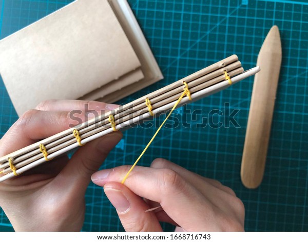 hand-made book binding\
craft paper notebook