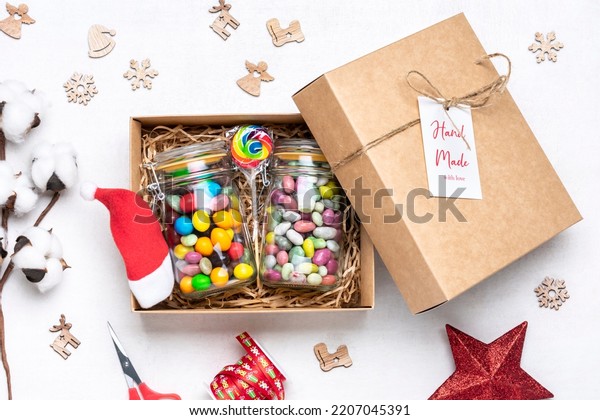 Handmade care package, seasonal gift box with candies,\
gingerbread, xmas decor Personalized eco friendly basket for\
family, friends, girl for thanksgiving, Christmas, mothers, fathers\
day Flat lay 