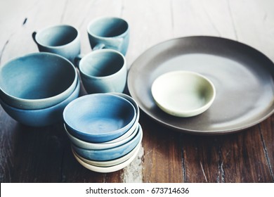 Handmade ceramic dishes on an old vintage table