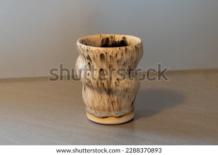 Handmade ceramic tumbler coated in sandstone glaze