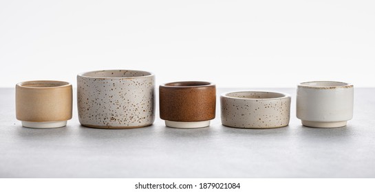 handmade ceramics, empty craft ceramic bowls on light background  - Powered by Shutterstock