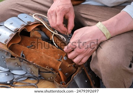 Hand-made chain mail as an element of an old warrior's armor, reconstruction of historical events