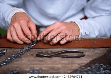 Hand-made chain mail as an element of an old warrior's armor, reconstruction of historical events