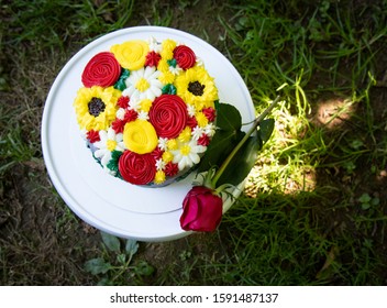 A Handmade Chocolate Cake Of Flowers For A Babies First Cake Smash. 